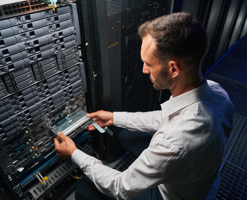Person installing hardware in data center